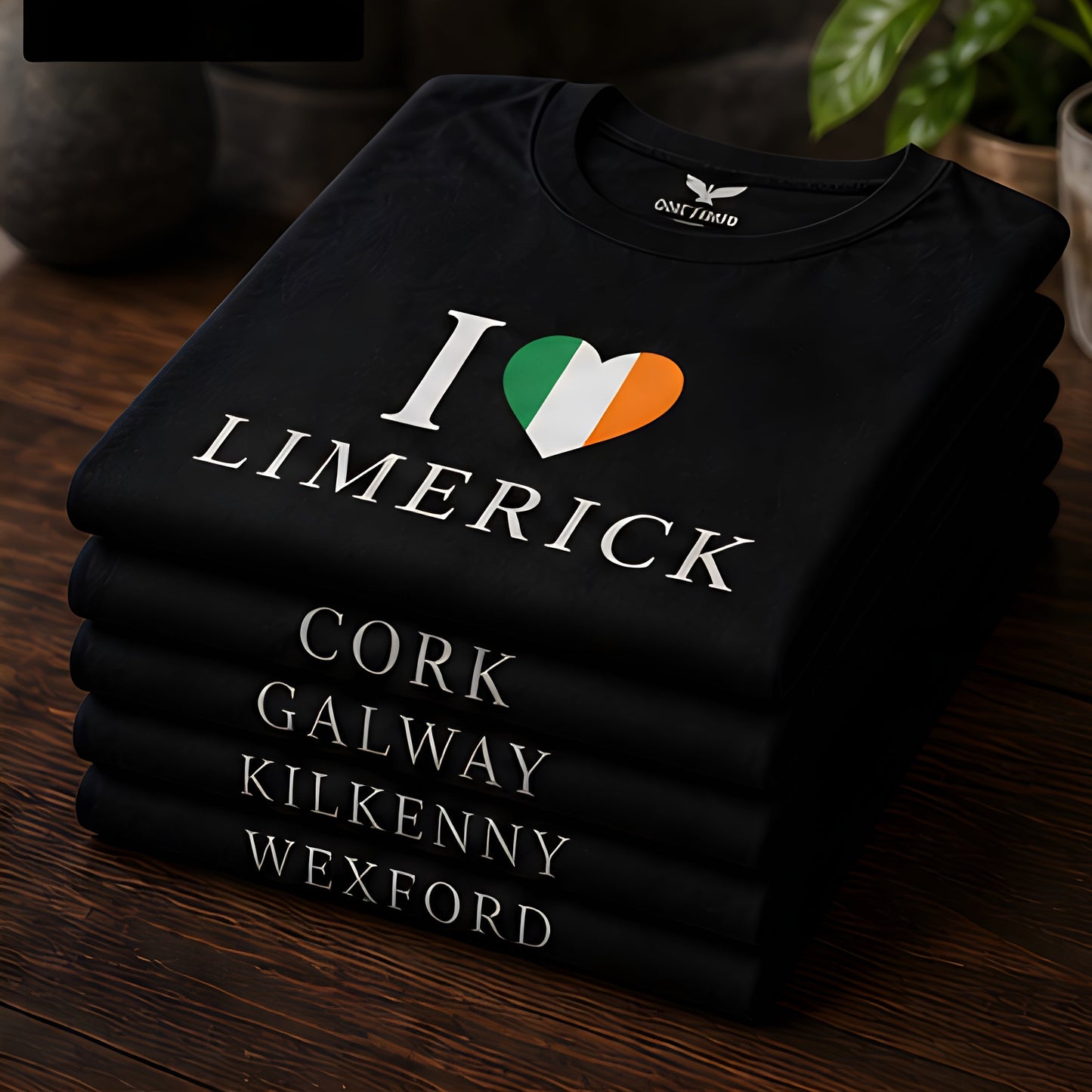 ONE1DUB black cotton t-shirt with "I Love Limerick" graphic and Irish flag heart. Stacked with other city name tees.